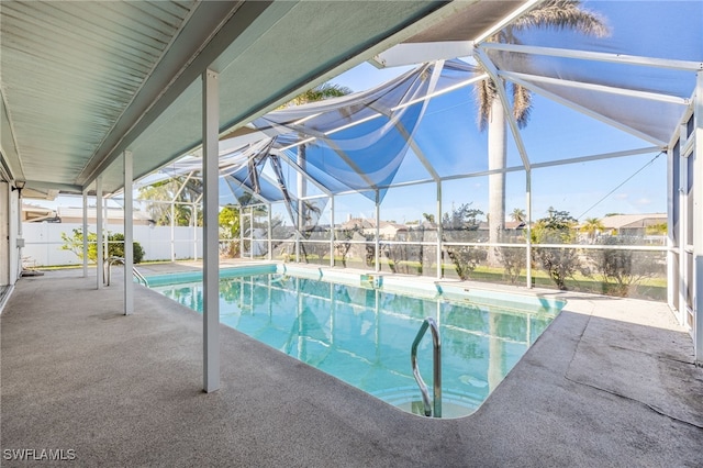 view of pool featuring a patio area and glass enclosure