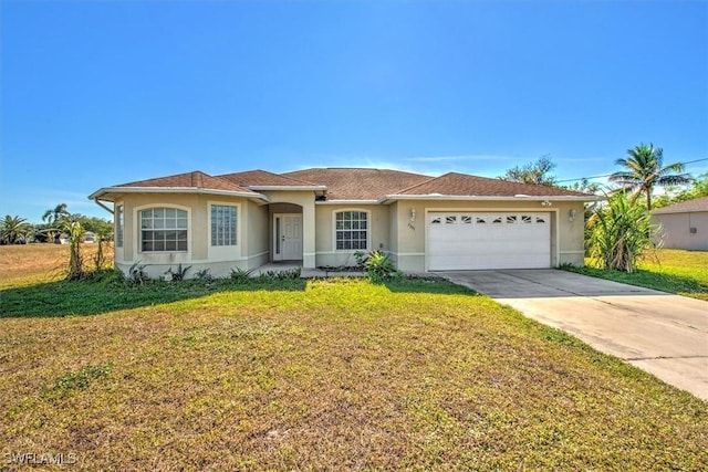 ranch-style house featuring a garage and a front lawn