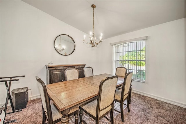 carpeted dining room featuring an inviting chandelier