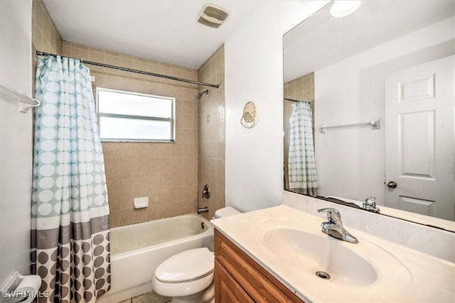 full bathroom featuring shower / bath combo with shower curtain, vanity, and toilet