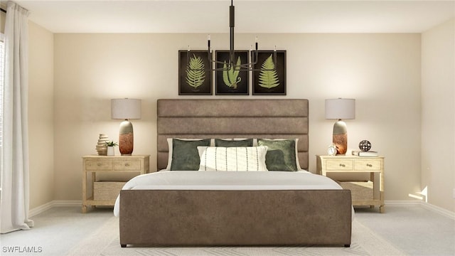 carpeted bedroom featuring a chandelier