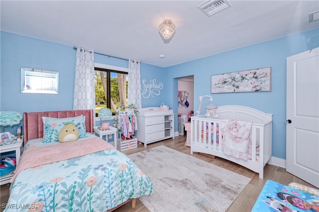 bedroom with wood-type flooring