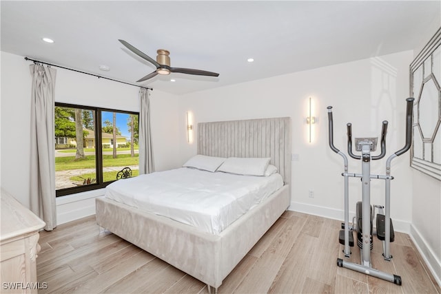 bedroom featuring ceiling fan and light hardwood / wood-style floors