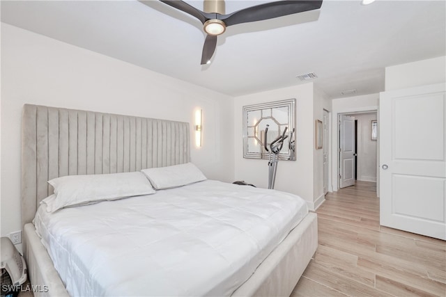 bedroom featuring ceiling fan and light hardwood / wood-style floors