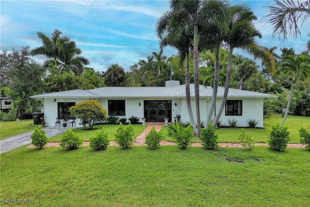 ranch-style home with a front yard