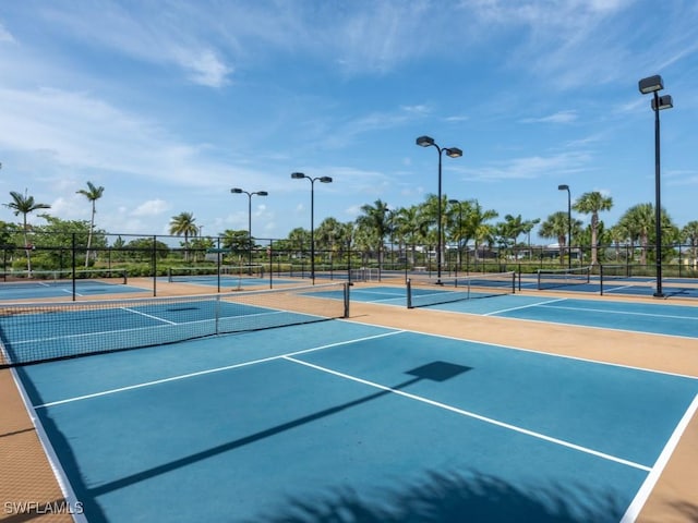 view of tennis court featuring basketball court