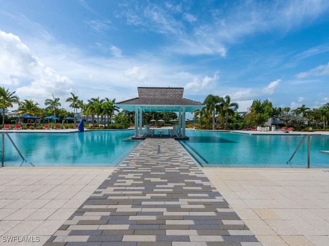 view of swimming pool with a gazebo and a patio area