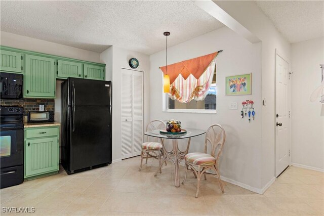 kitchen featuring green cabinets, pendant lighting, a textured ceiling, decorative backsplash, and black appliances