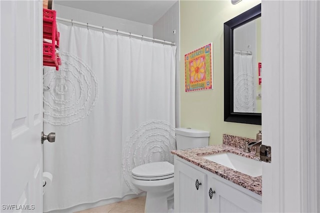 bathroom with toilet, tile patterned floors, a shower with curtain, and vanity