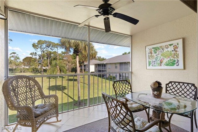 sunroom with a ceiling fan