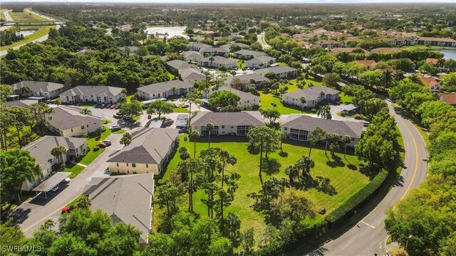 bird's eye view featuring a water view and a residential view