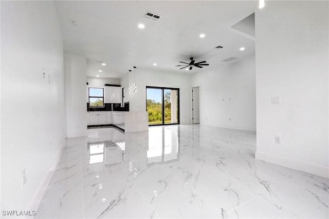 interior space featuring ceiling fan