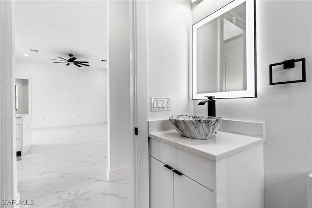 bathroom with ceiling fan and vanity