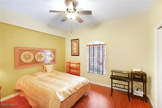 242 Newport Dr Unit 502, Naples, FL 34114 - bedroom featuring ceiling fan, baseboards, and wood finished floors