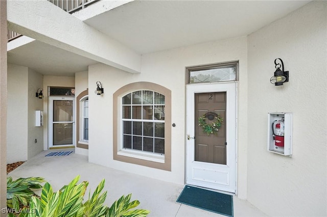 242 Newport Dr Unit 502, Naples, FL 34114 - doorway to property featuring stucco siding