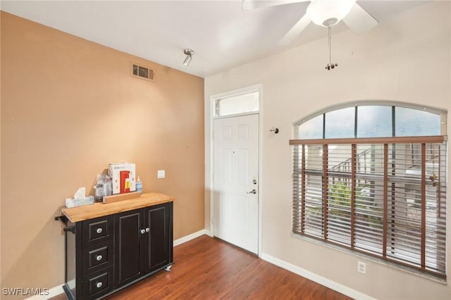 entryway featuring ceiling fan and dark hardwood / wood-style floors