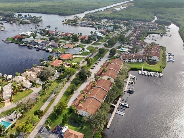 bird's eye view with a water view and a residential view