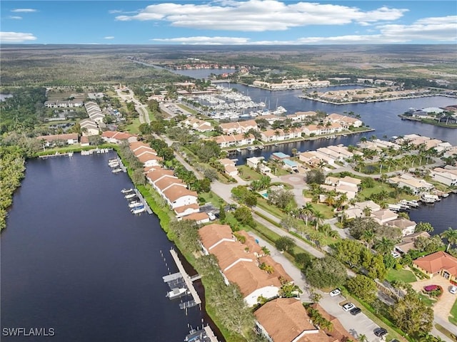 birds eye view of property featuring a residential view and a water view