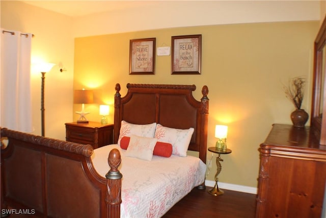 242 Newport Dr Unit 502, Naples, FL 34114 - bedroom featuring baseboards and dark wood-type flooring