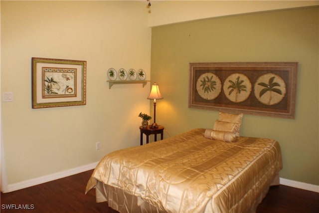 bedroom featuring dark hardwood / wood-style floors