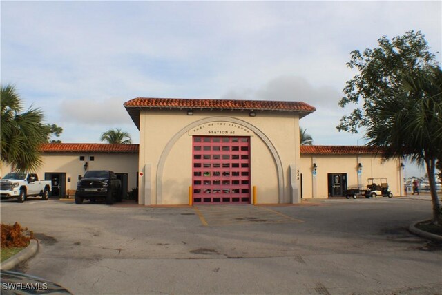 view of property featuring uncovered parking