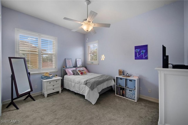 bedroom featuring ceiling fan and light carpet