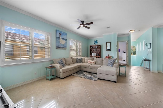 tiled living room featuring ceiling fan and ornamental molding