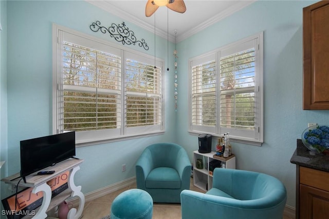 sitting room featuring ceiling fan and crown molding