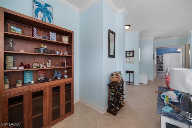 corridor featuring light tile patterned flooring and crown molding