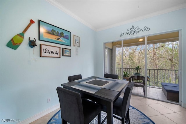 dining space featuring light tile patterned floors and crown molding