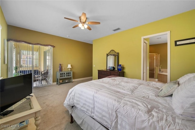 carpeted bedroom featuring ceiling fan and ensuite bathroom