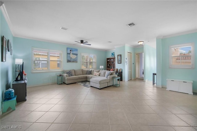 tiled living room featuring ceiling fan and crown molding