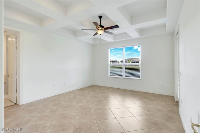 tiled spare room featuring ceiling fan and coffered ceiling