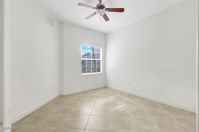 unfurnished room featuring ceiling fan and light tile patterned flooring