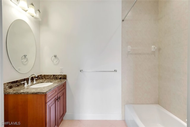 bathroom featuring tile patterned floors, vanity, and tiled shower / bath combo