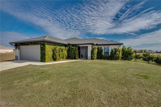 view of front facade with a front yard and a garage