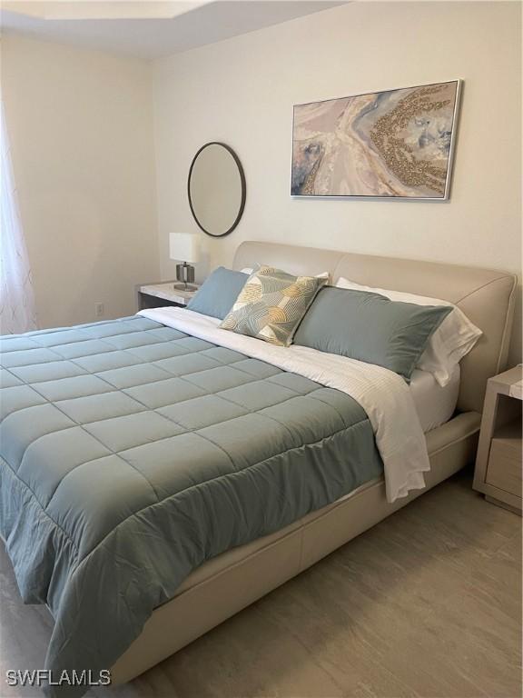 bedroom featuring hardwood / wood-style flooring