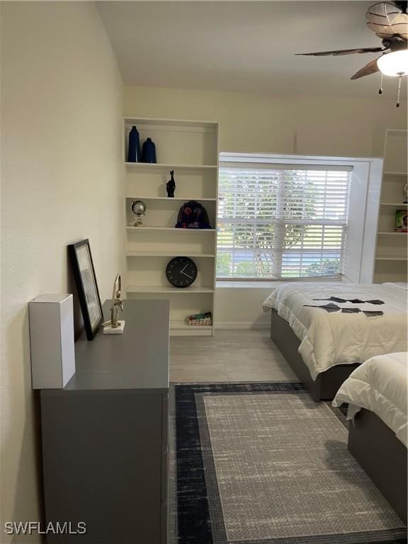 bedroom with ceiling fan and hardwood / wood-style floors