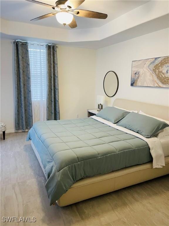 bedroom featuring ceiling fan and light hardwood / wood-style floors