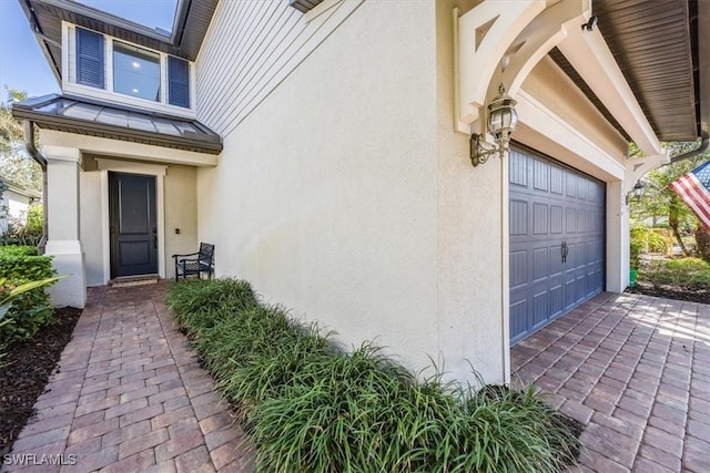 property entrance with a garage