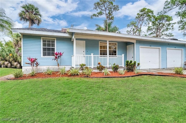 ranch-style home with covered porch, a garage, and a front yard