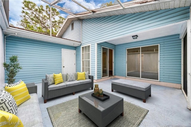 view of patio / terrace with outdoor lounge area and glass enclosure