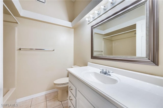 bathroom with tile patterned floors, vanity, and toilet