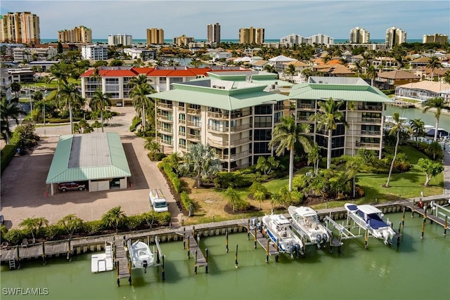 birds eye view of property featuring a water view