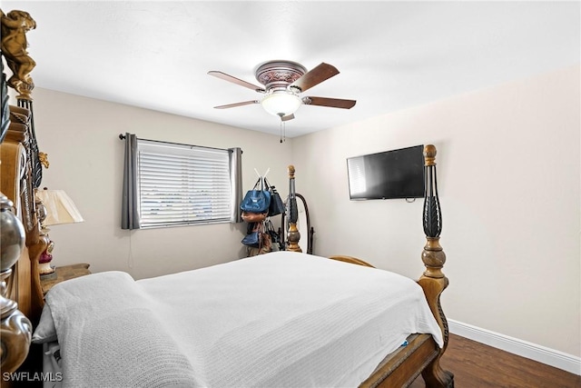 bedroom with ceiling fan and wood-type flooring