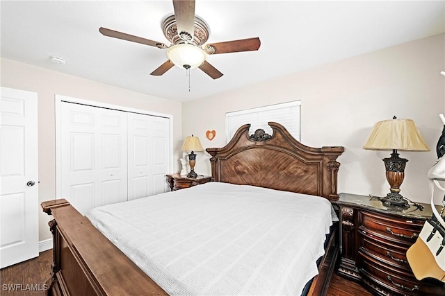 bedroom with ceiling fan, dark wood-type flooring, and a closet