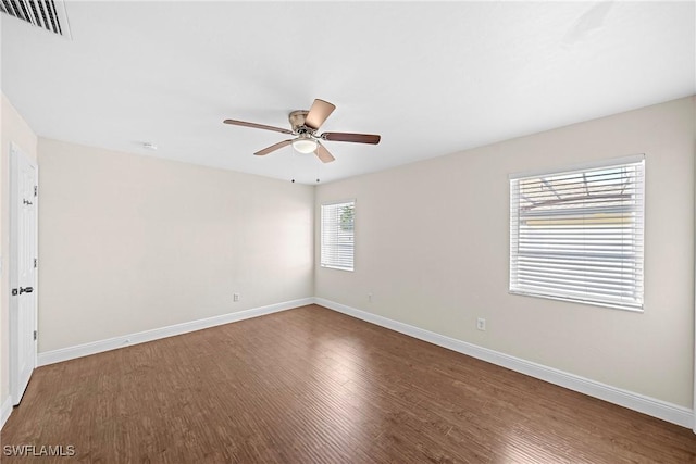 spare room featuring ceiling fan and wood-type flooring