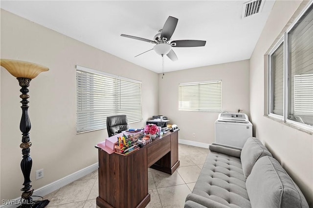 office with ceiling fan, light tile patterned floors, and washer / clothes dryer