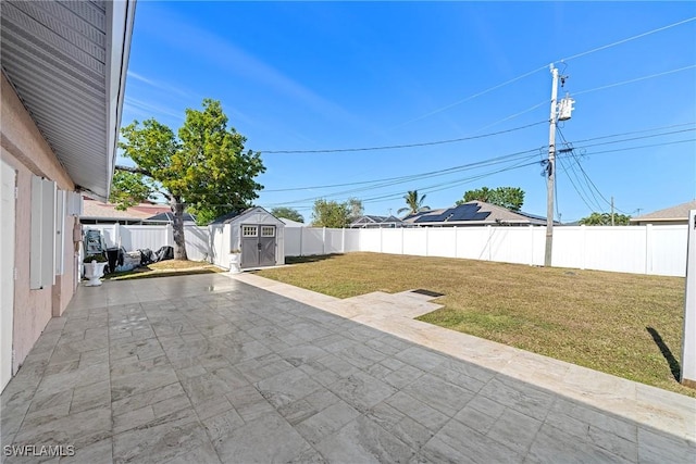 view of patio featuring a shed