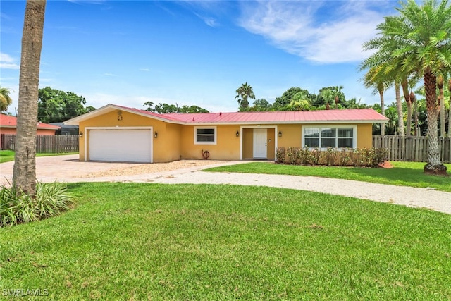 ranch-style home featuring a garage and a front yard